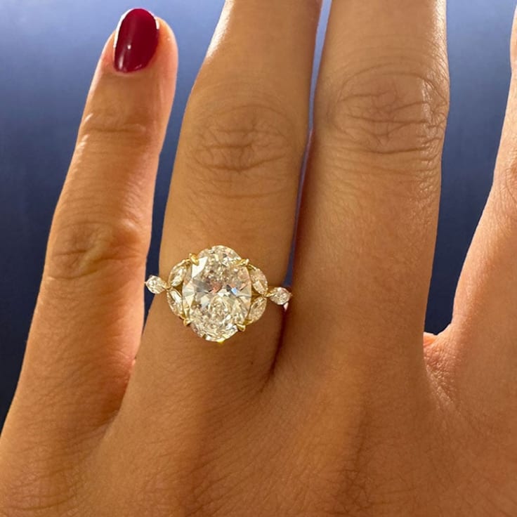 Oval lab with marquise side stone ring