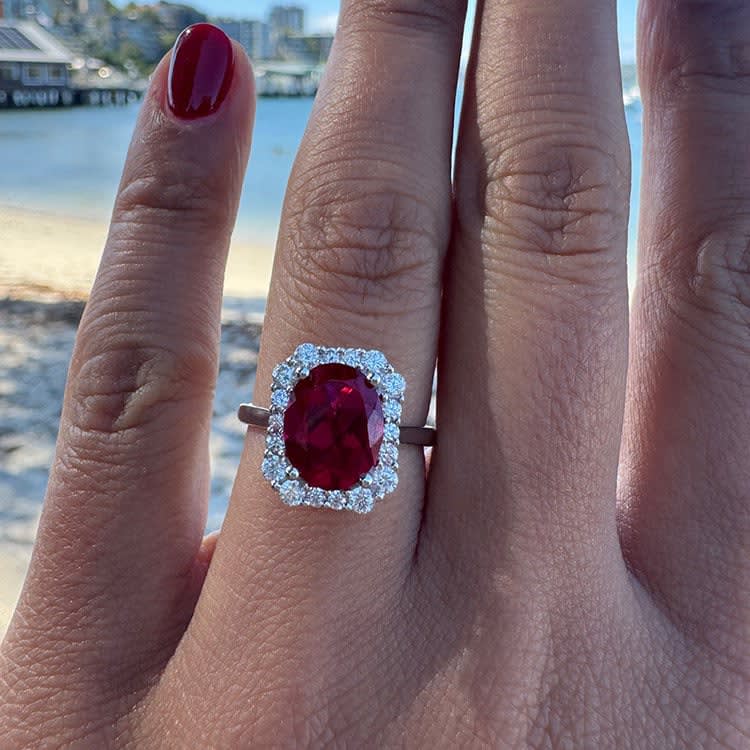 Lab grown oval ruby ring with diamond