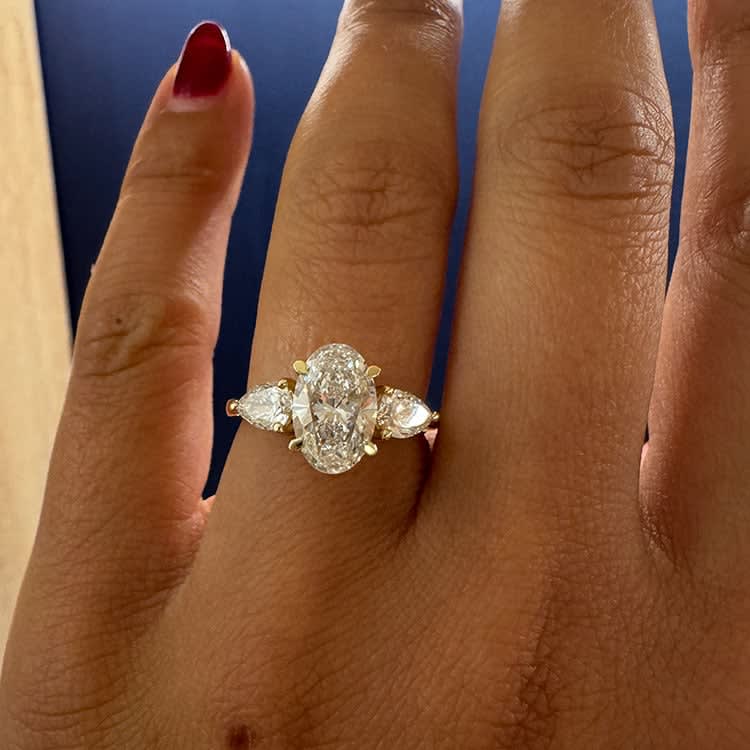 2 carat oval in a trilogy setting