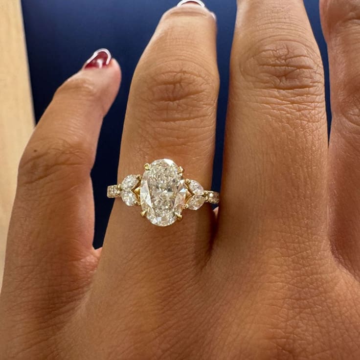 Oval lab with marquise engagement ring