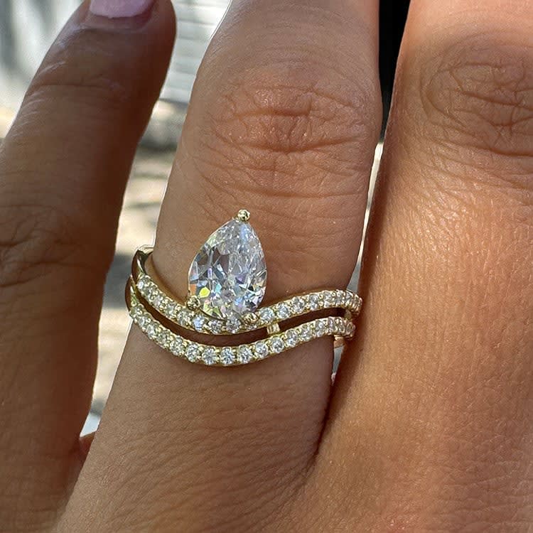 Pear double band solitaire ring