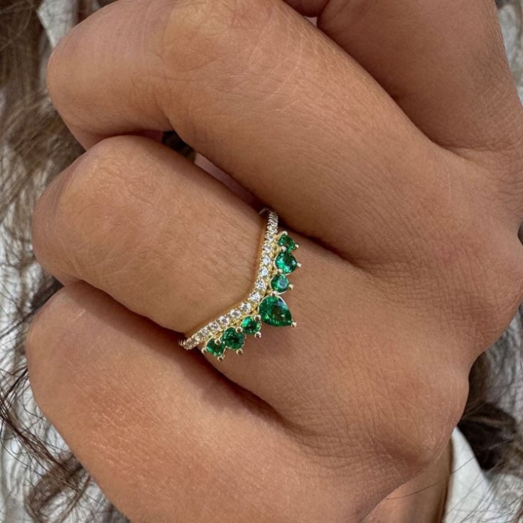 Green emerald and diamond curve band