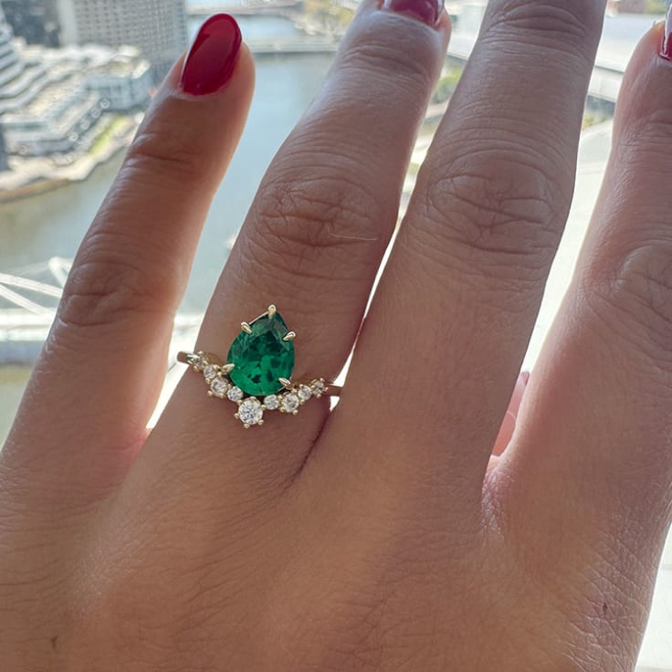 Pear green emerald and diamond ring