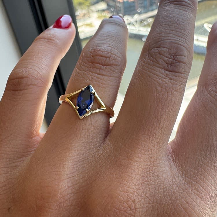 Marquise cut Blue sapphire on a plain band