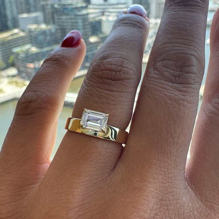 Emerald cut cigar engagement ring
