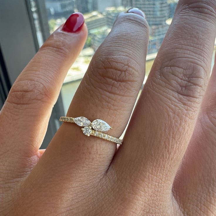 Two pears with round diamond band