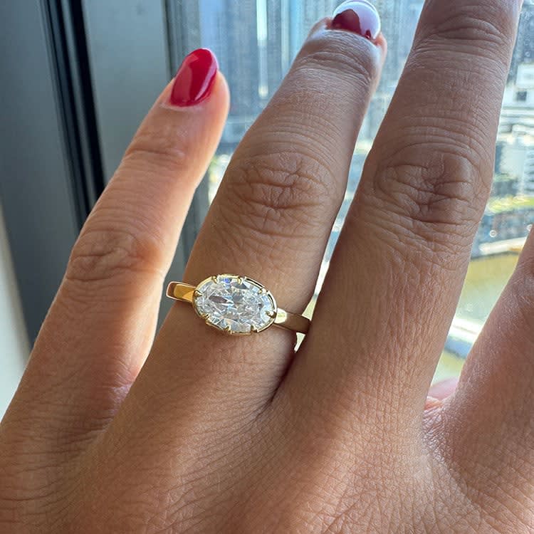 Oval east west solitaire ring