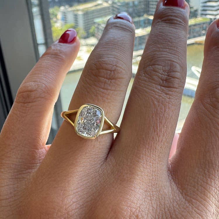 Bezel set cushion cut diamond