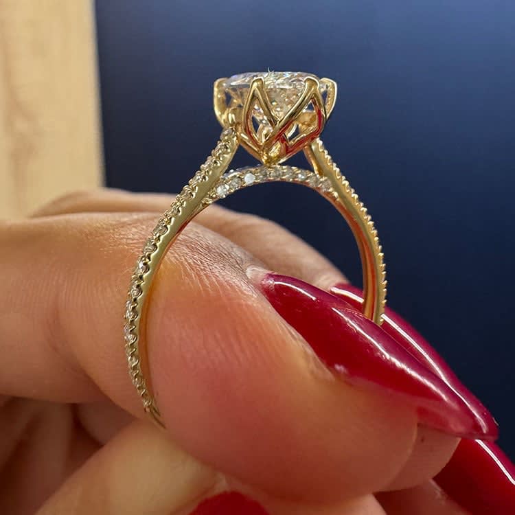 Oval cut diamond in tulip setting