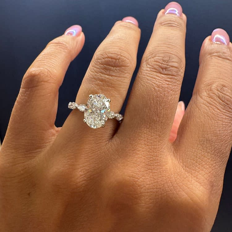 Oval diamond on a marquise cut band