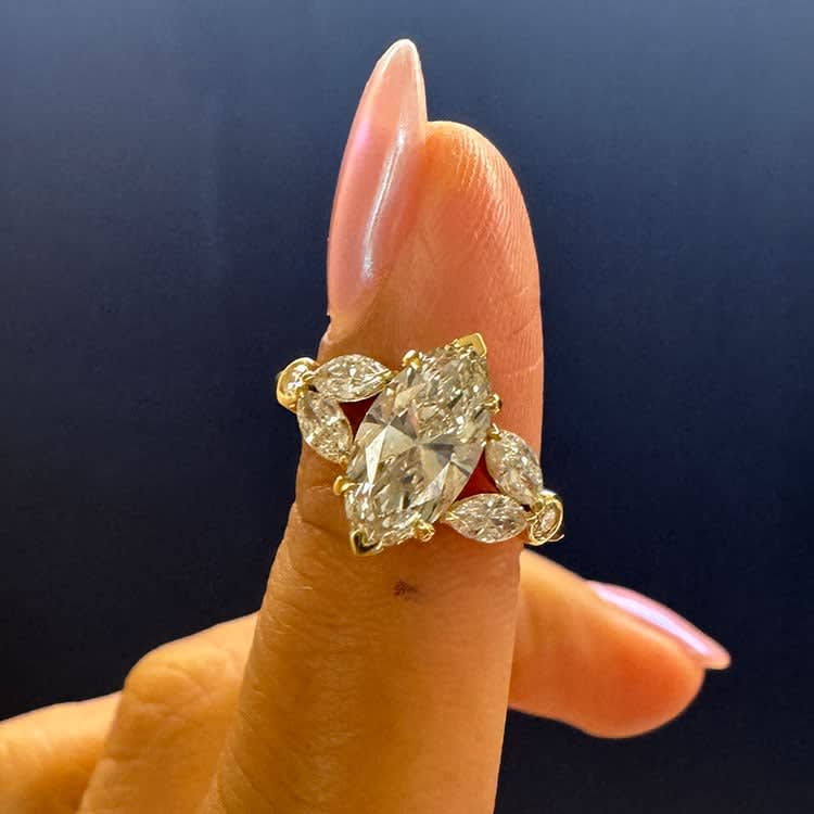 Marquise diamond with side marquise engagement ring