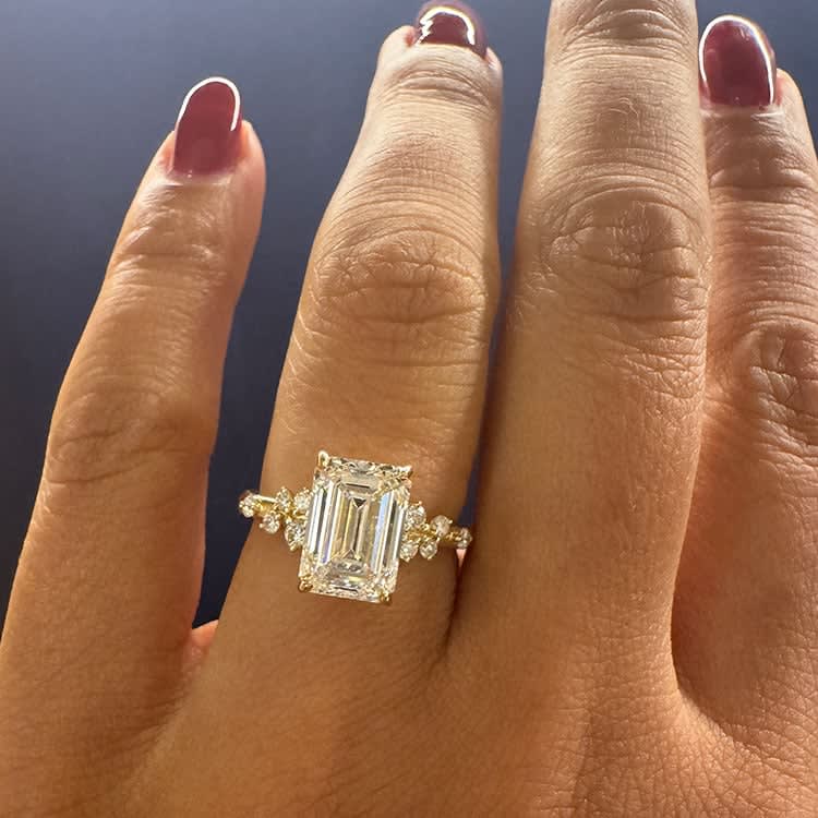 Emerald cut diamond on unique band