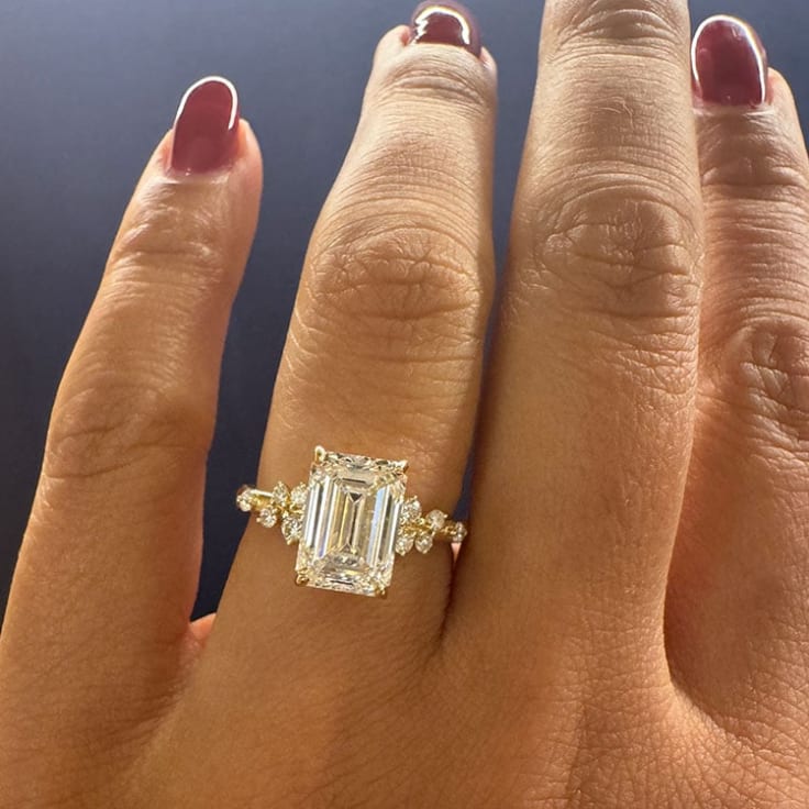 Emerald cut diamond on unique band