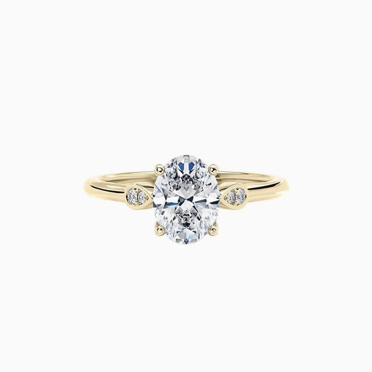 Oval Diamond ring with bezel set side stones