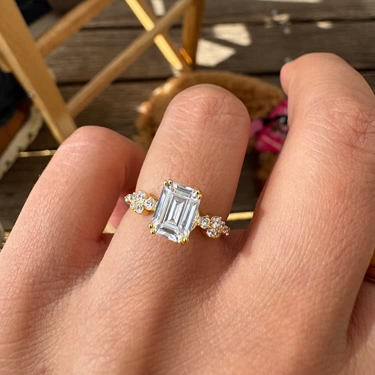 Emerald cut diamond engagement ring with double prongs