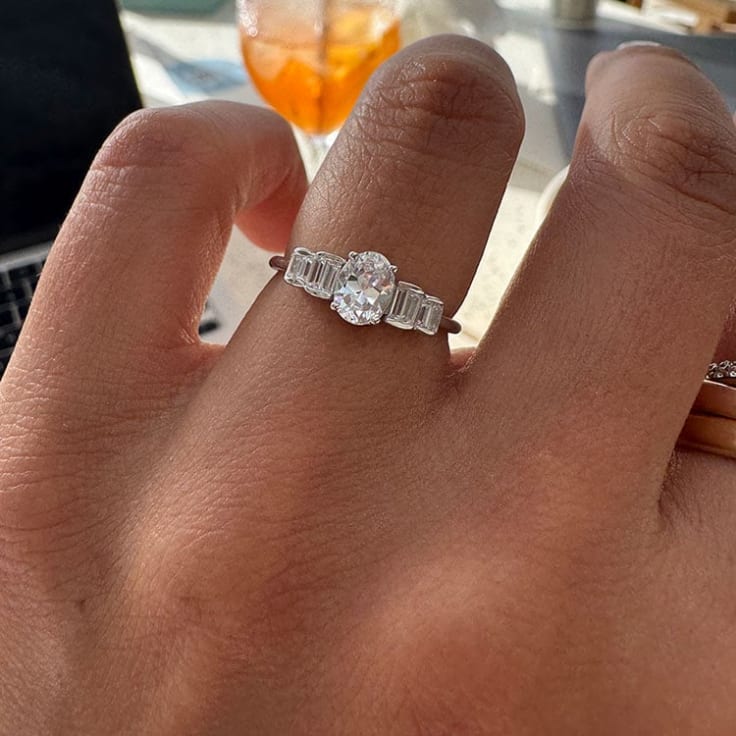 Oval petite diamond ring with baguettes