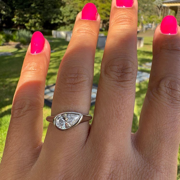 Pear diamond Bezel set on a solid band