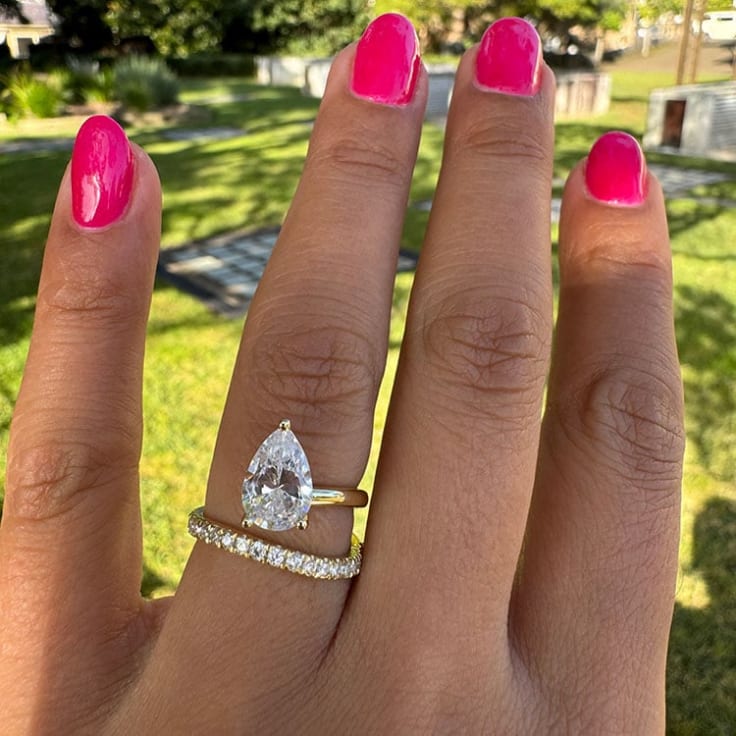 Pear diamond on a unique setting engagement ring