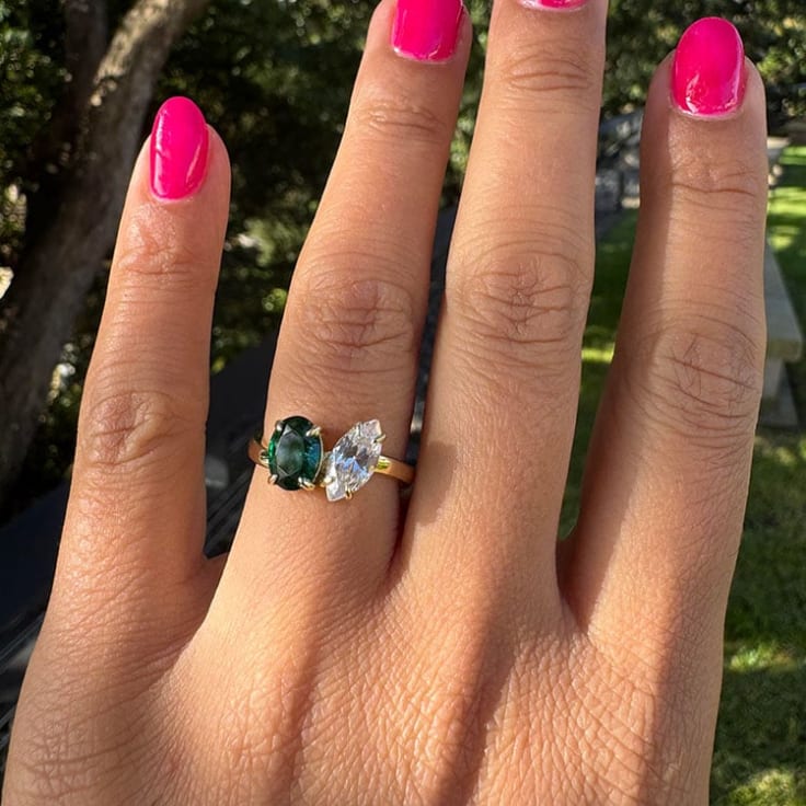 Green and white two stone ring