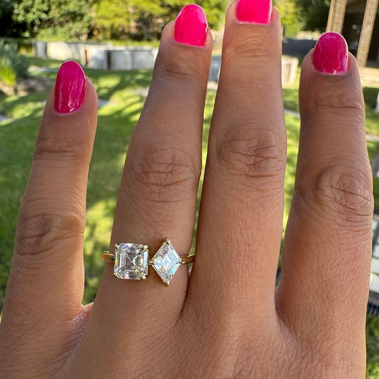 Step cut two stone engagement ring