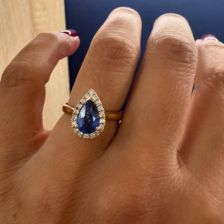 Natural blue sapphire with halo and plain band