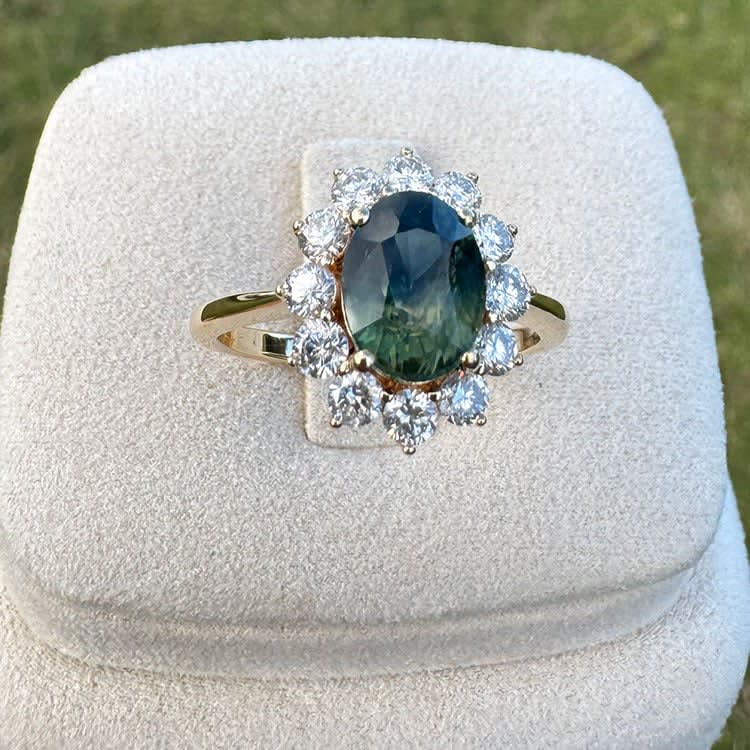 Natural teal sapphire oval engagement ring