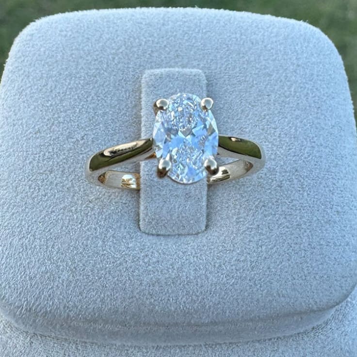 1ct oval solitaire on a gold band