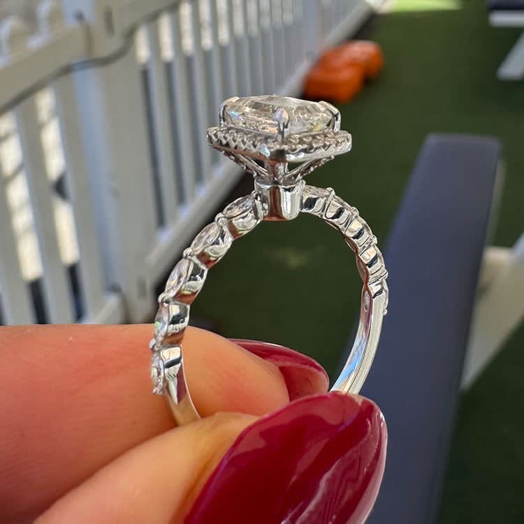 Emerald with halo and marquise band