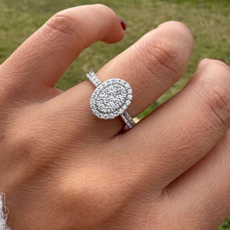 Oval cluster with halo and diamond band