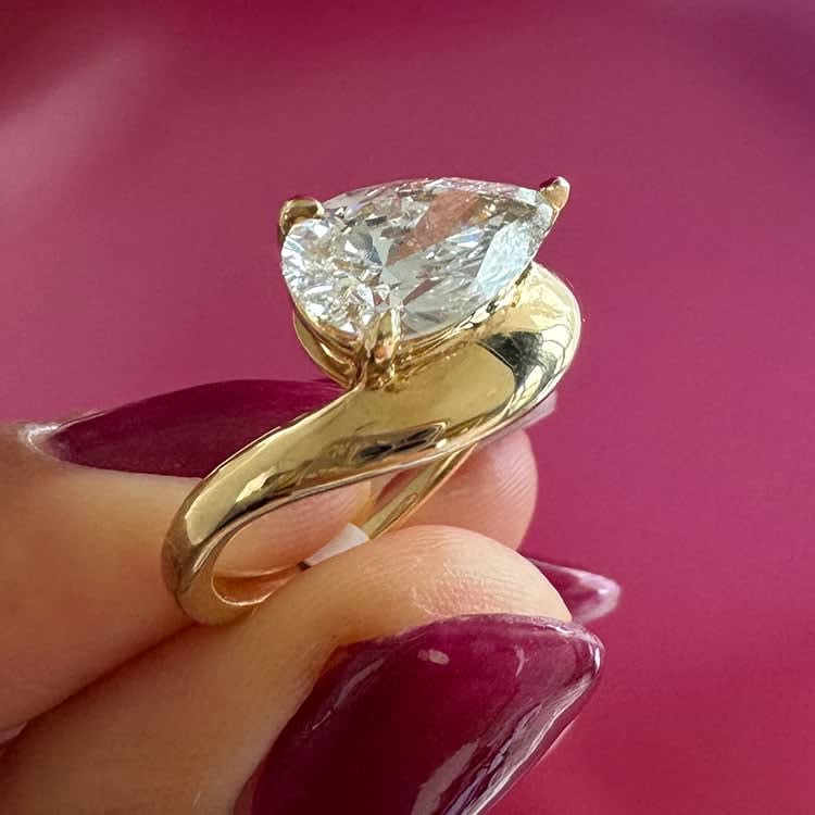 Pear diamond on a thick gold band