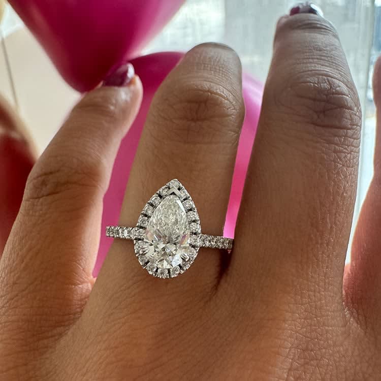 Classic pear with a halo and diamond band