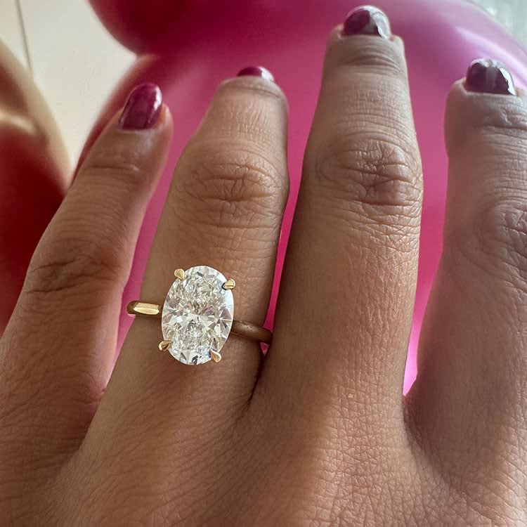 3ct oval on a classic band with hidden halo