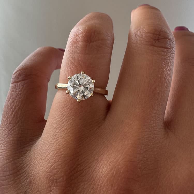 Classic 6 prong set with 2 carat round diamond