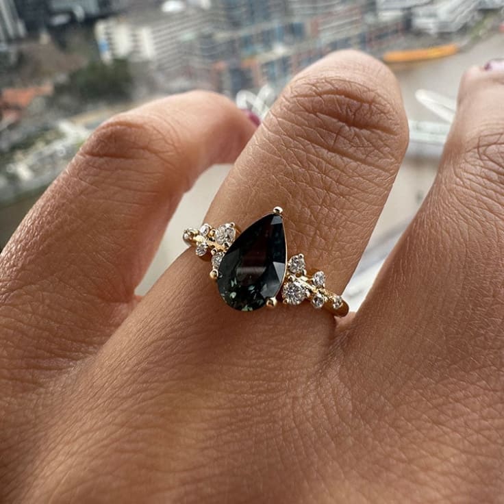 Pear cut natural green sapphire ring