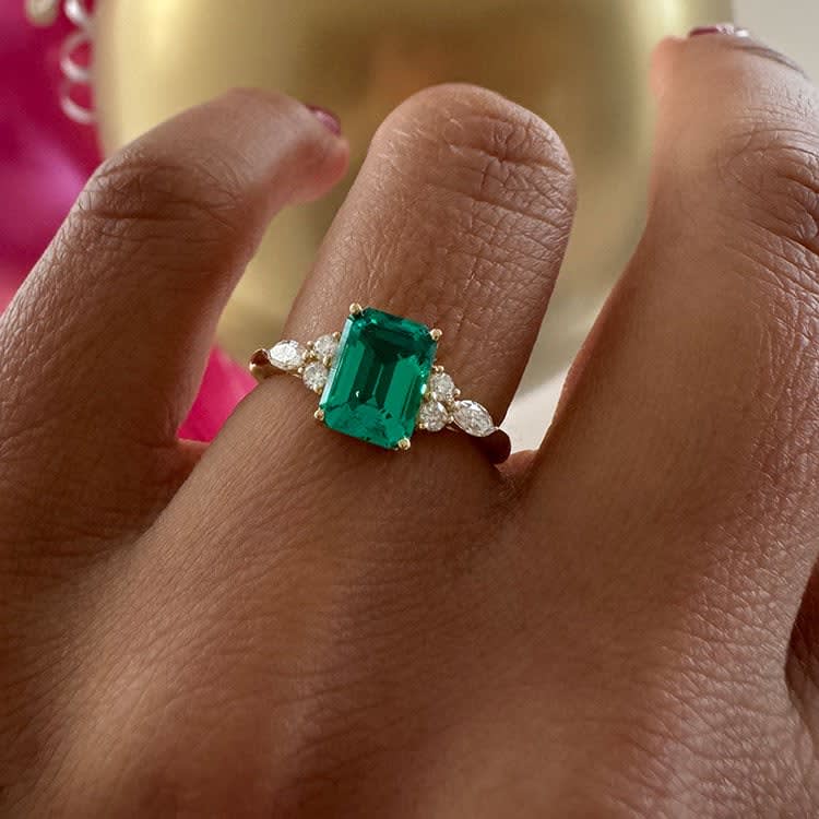 Lab emerald and diamond ring set in gold