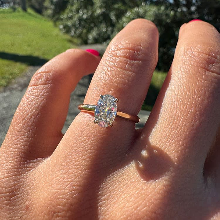 1 carat oval diamond on a gold band