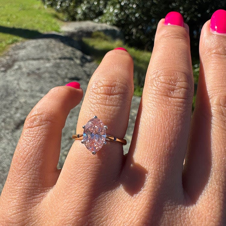 Fancy vivid pink oval diamond engament ring