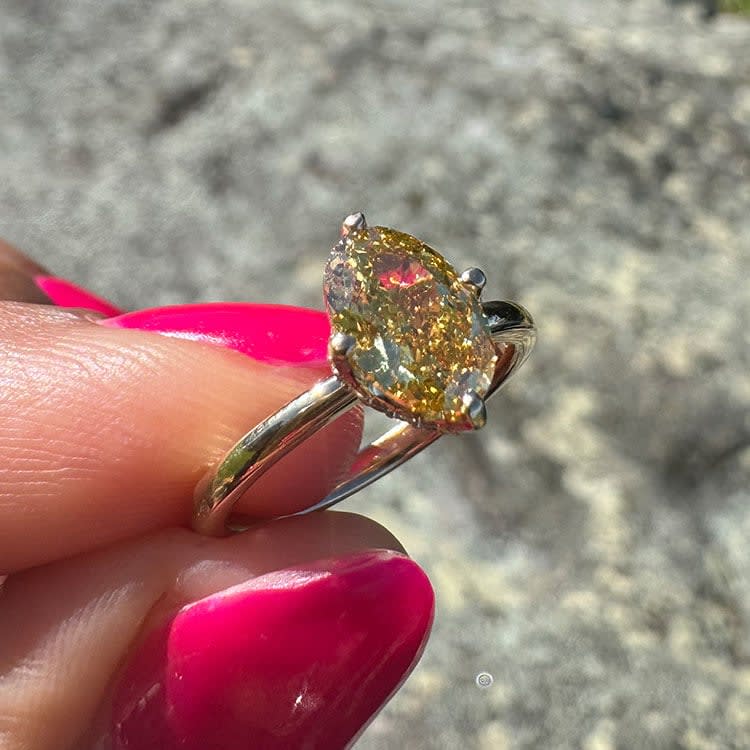 Fancy vivid yellow diamond ring