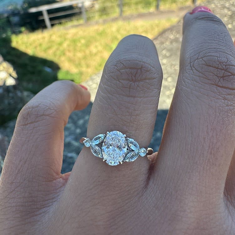 White diamond with pale blue side stones