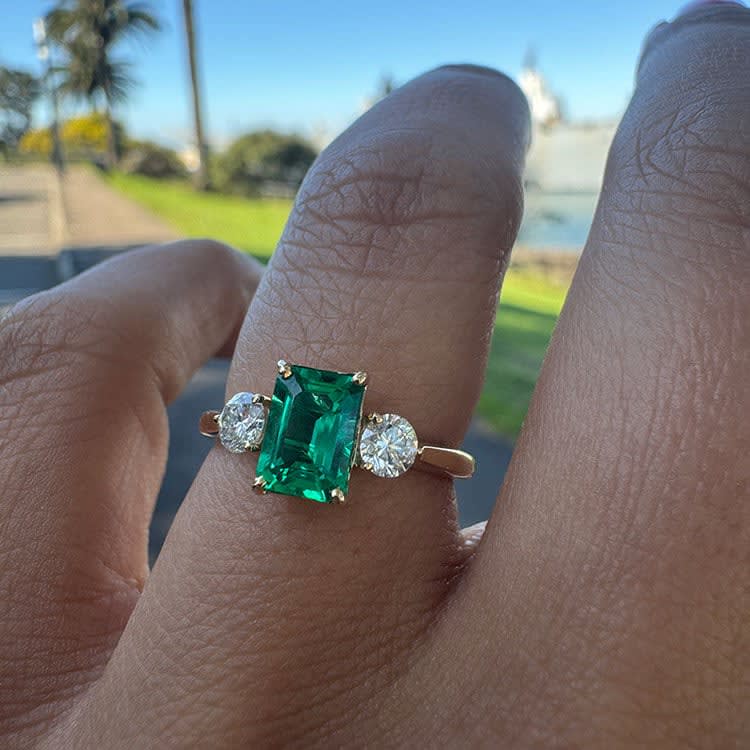 Lab green emerald with white diamonds
