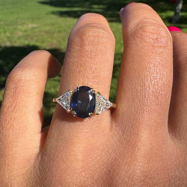 Natural dark blue sapphire with trillions