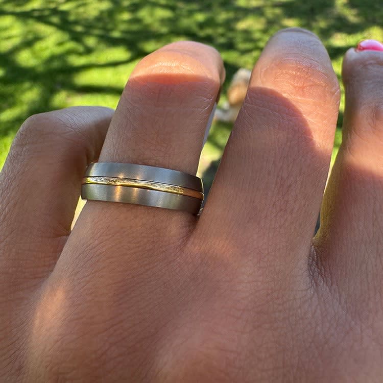 18k yellow stripe on a titanium band