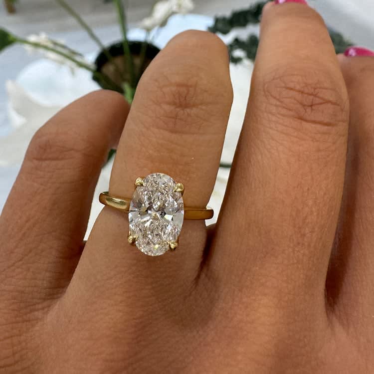 Oval diamond with a tulip setting