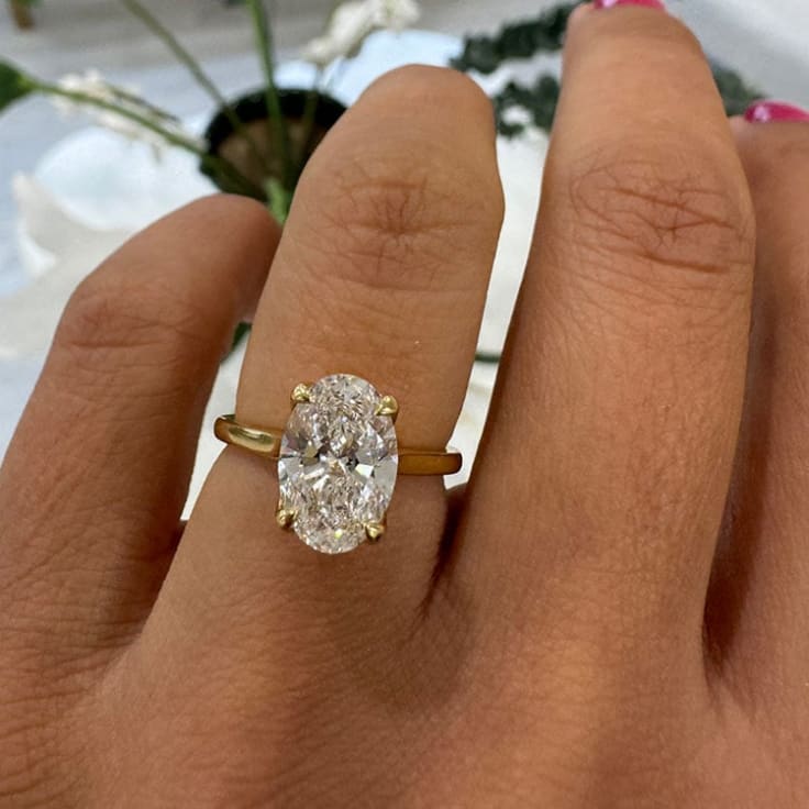 Oval diamond with a tulip setting