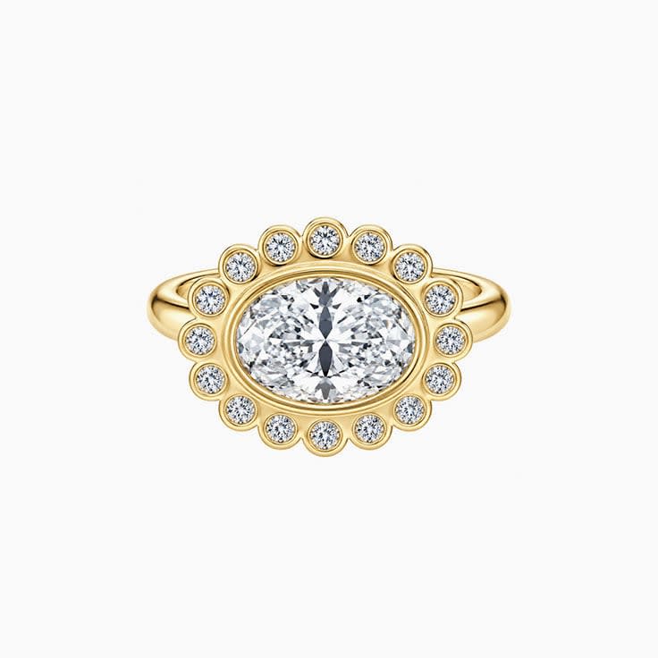 East west oval with a bezel halo
