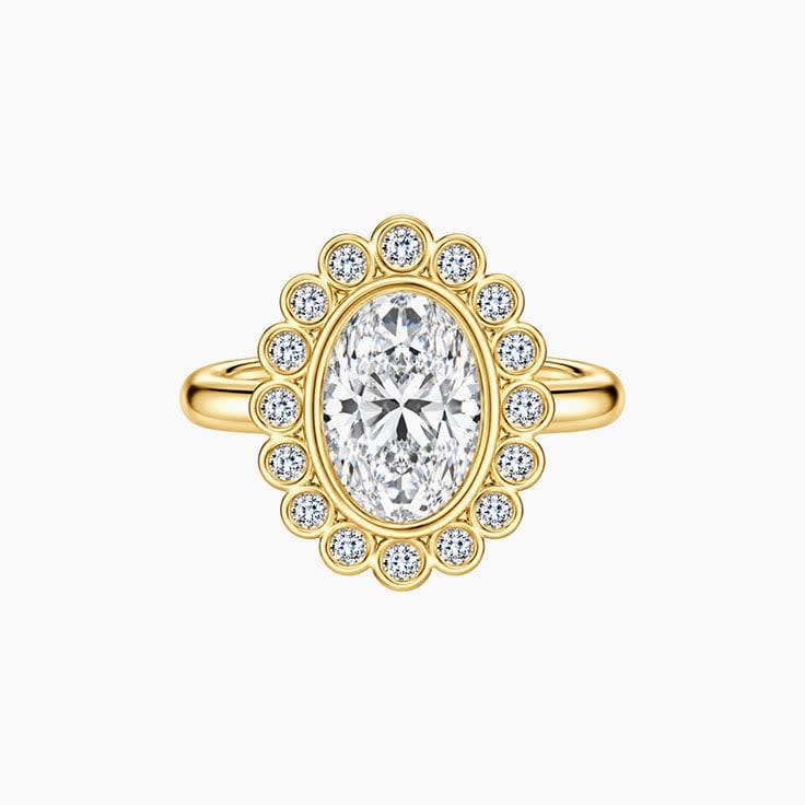 oval diamond with bezel set halo