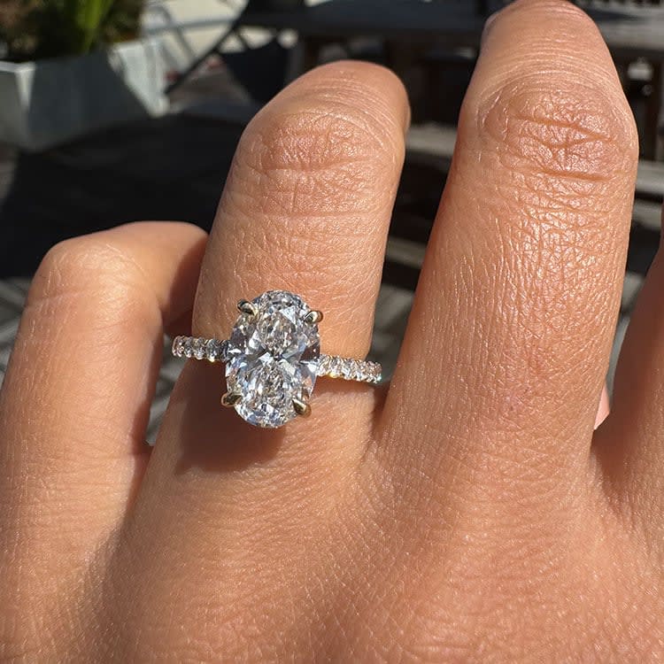 Oval lab diamond with yellow gold setting