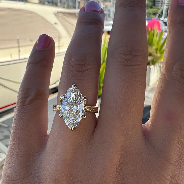 4ct moval in a tulip setting and vintage band