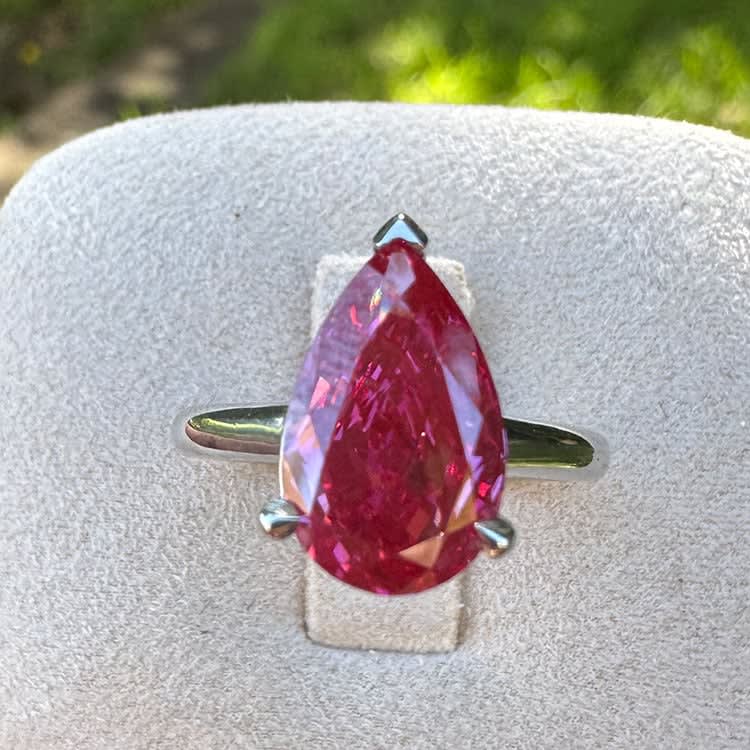 Fancy vivid pink pear diamond ring