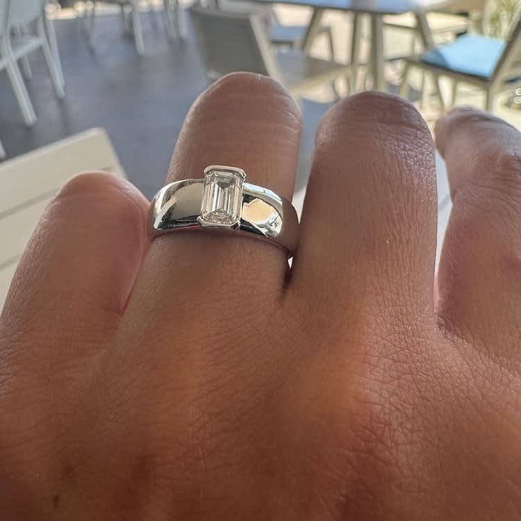 1 carat emerald in a wide silver band